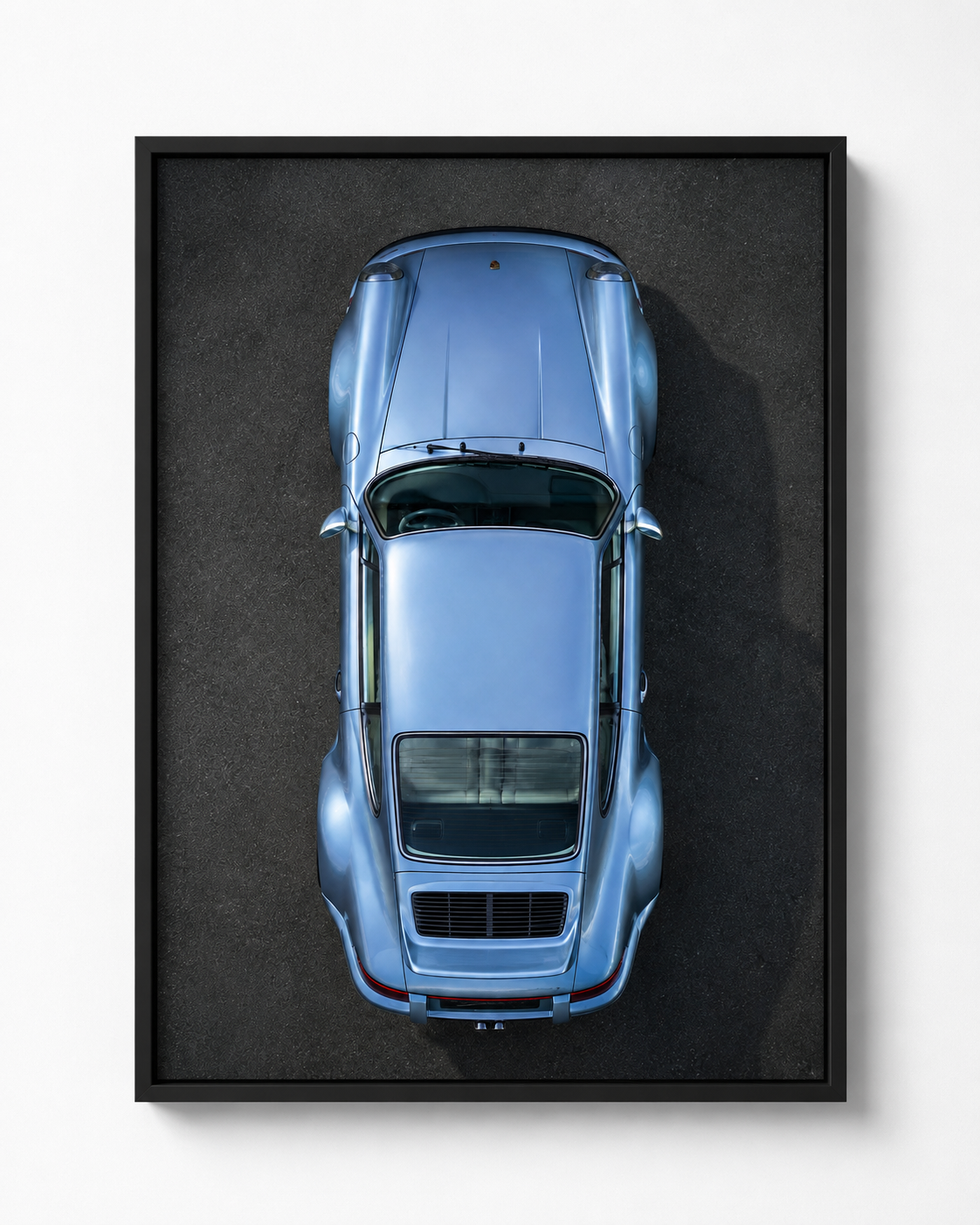 Baby Blue overhead Porsche automotive artwork in a black frame