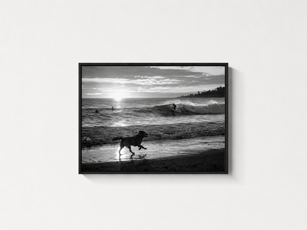 Chasing Waves black and white coastal wall art in a black frame