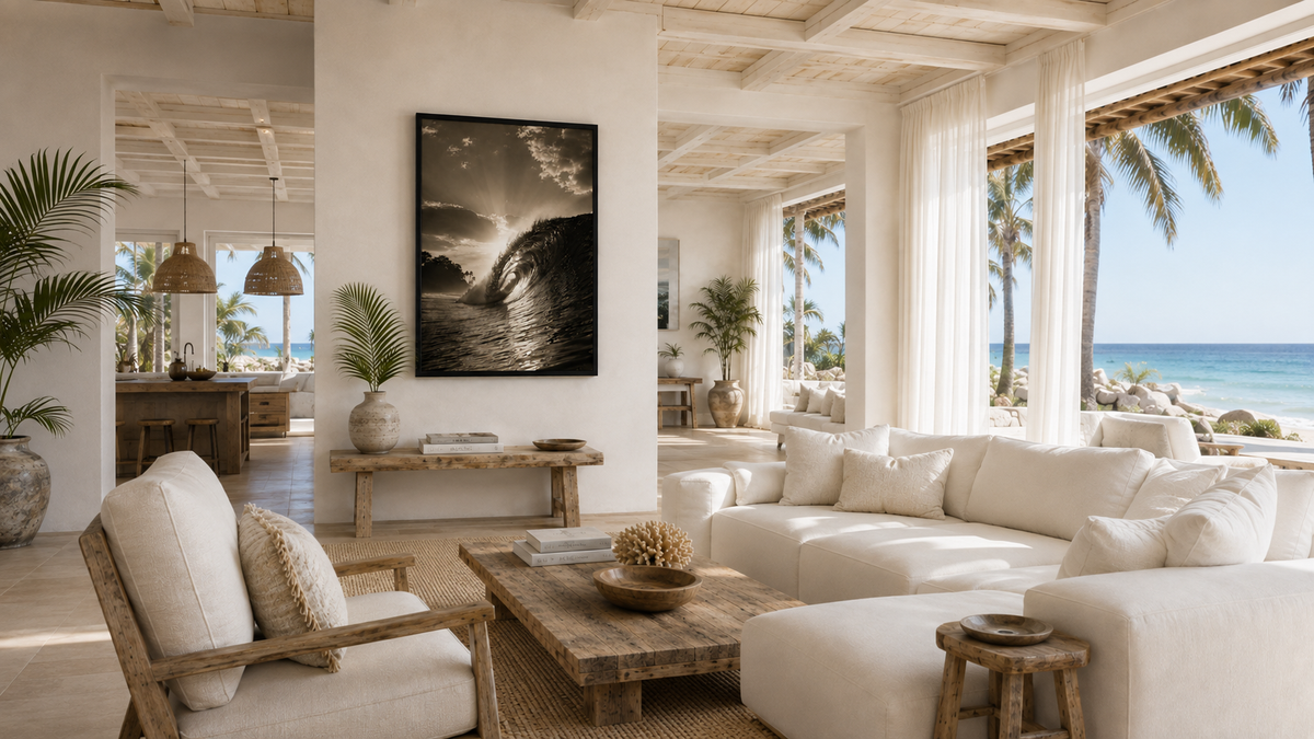 Coastal wall art hanging above a couch in a wide modern living room