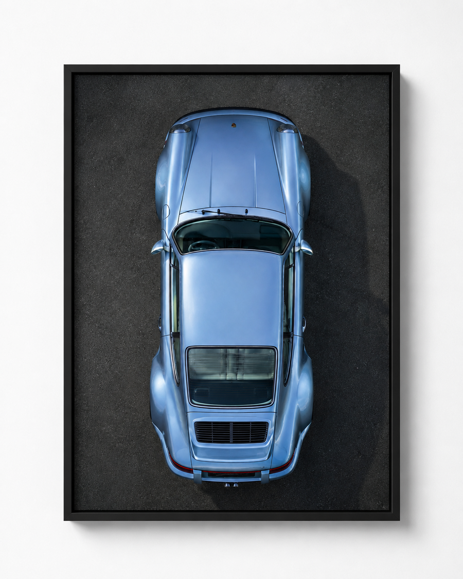 Baby Blue overhead Porsche automotive artwork in a black frame