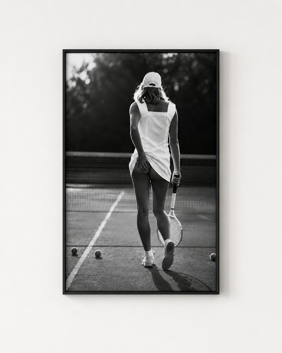Black and white tennis player photography print in a black frame