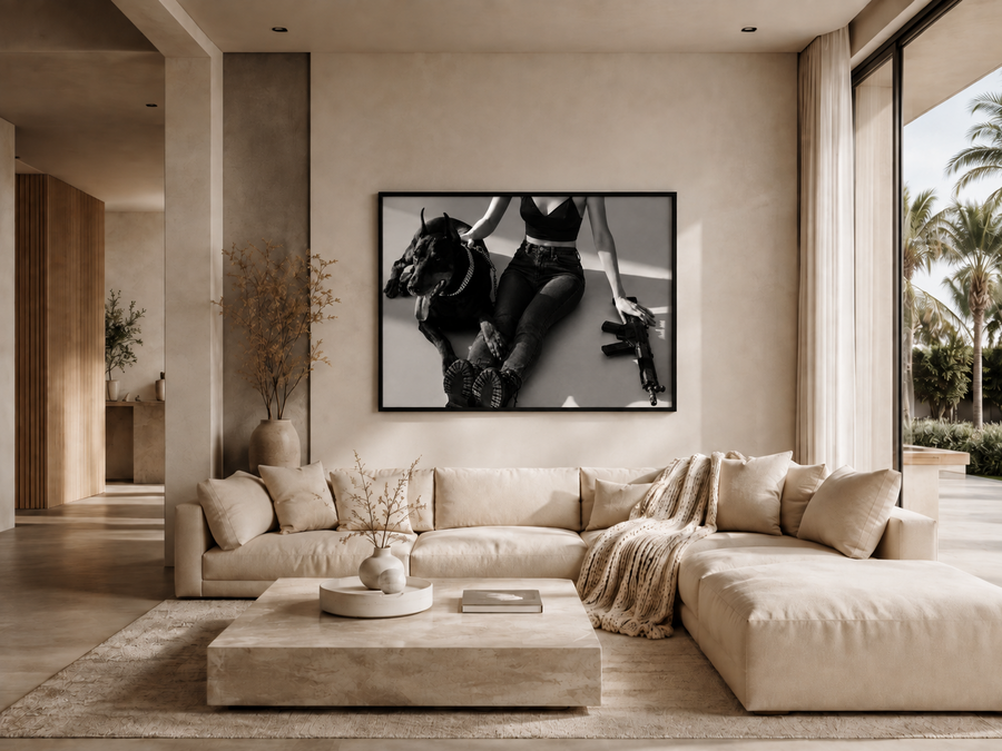 Guarded wall art displayed above a sofa in a modern Palm Beach interior