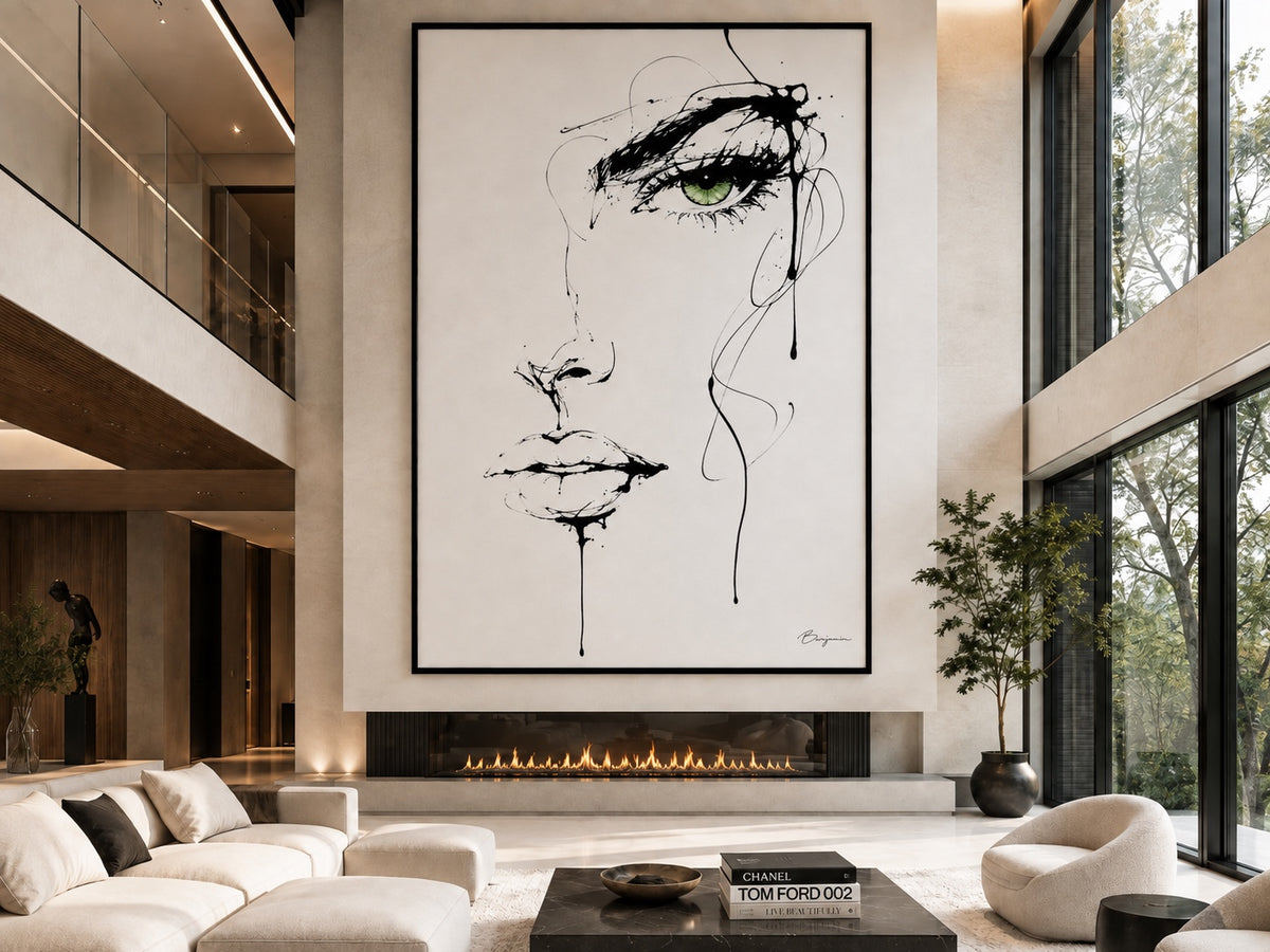Inked oversized framed portrait artwork displayed above a modern glass fireplace displayed in a room