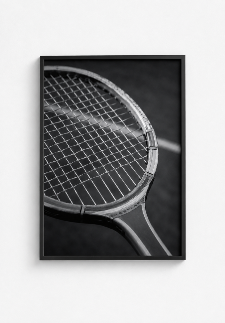 Black and white vintage tennis racket photography print in a black frame